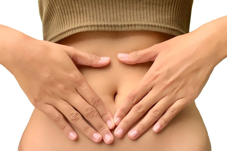 woman touches stomach