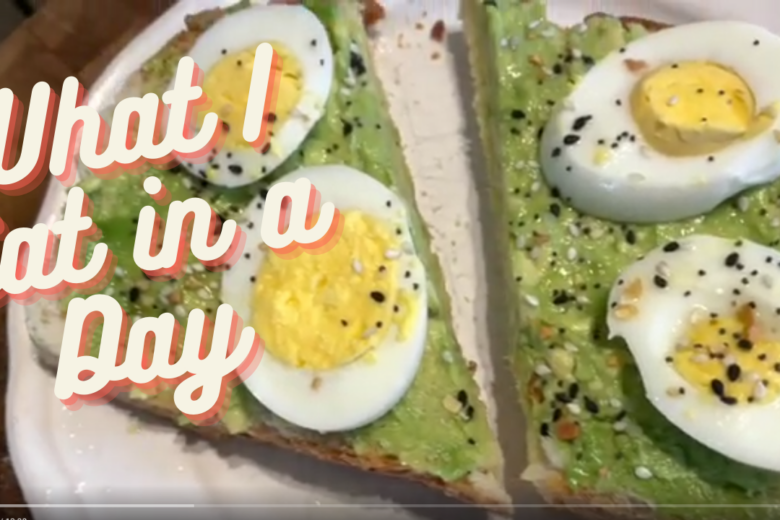 Avocado toast topped with hard boiled egg.
